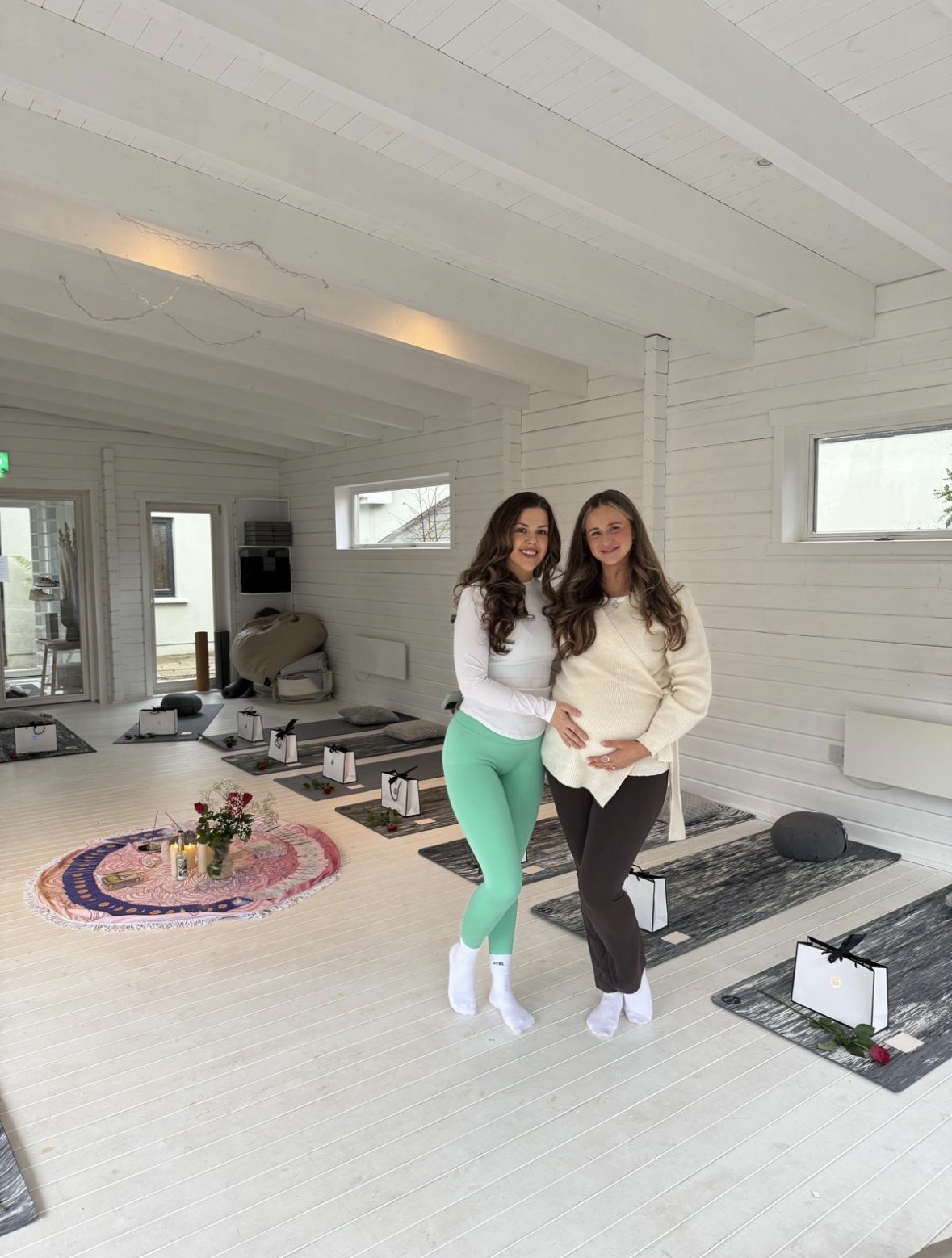 Eva and Siobhan in the bright white studio set up for a previous retreat