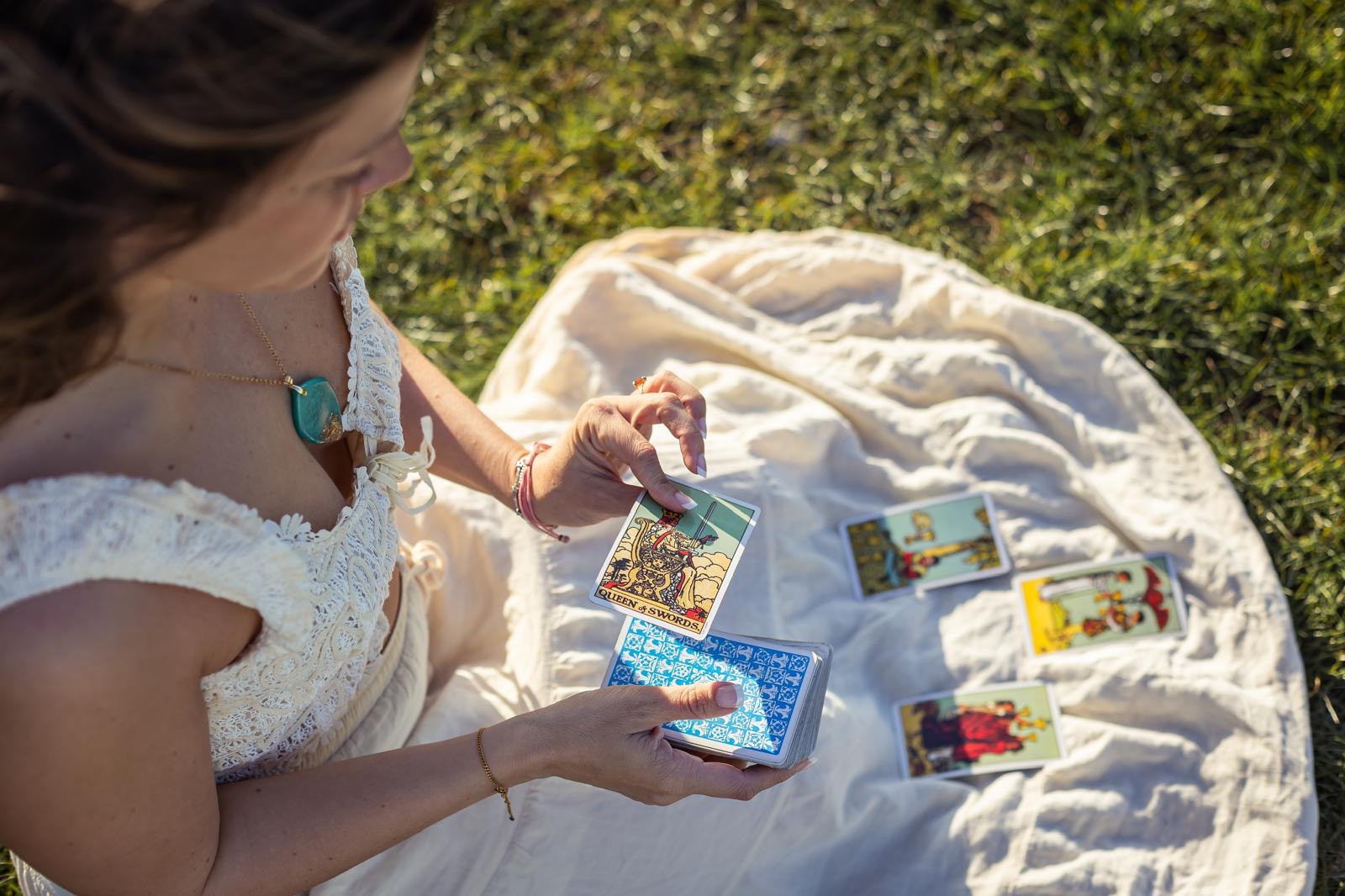 Eva laying tarot cards on a linen cloth